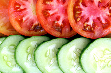fresh cucumbers and tomatoes cut into slices