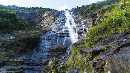A huge waterfall in Vietnam's national park Bachma. Bottom view.