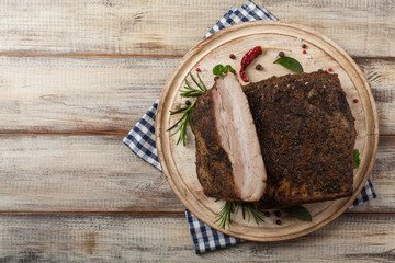 Baked whole pork bacon.