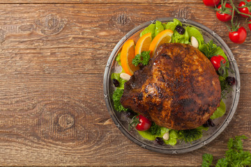 Baked ham, served on an old plate.