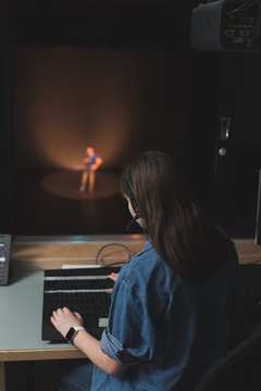 Female sound recordist working in theater