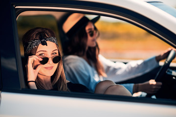 Two young women having fun on road trip