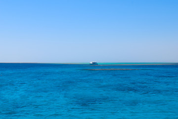 ship sailing on the ocean, beautiful turquoise water and blue sky