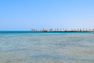Fototapeta na wymiar ocean in front of hurghada, beautiful red sea, view over a dock in the red sea