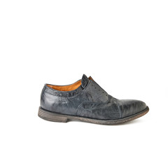 Elegant men's black laceless shoe. Studio shot, white background