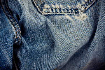 defective jeans background denim with a seam of vintage fashion design denim texture
