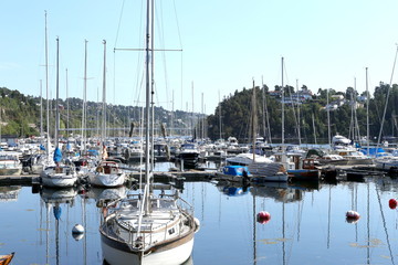 Fototapeta na wymiar Oslo, Norway - July 22, 2018: Yachts and boats in the harbor in Oslo Fjord. Oslo harbor is located in the inner Oslofjord, just east of the city center. 