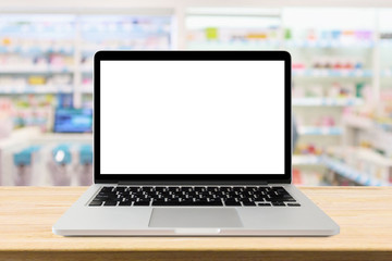 Laptop computer blank screen on pharmacy counter drugstore shop interior