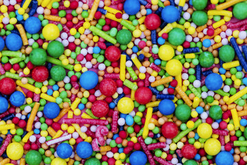 Colourful candy cake decorative sprinkles background