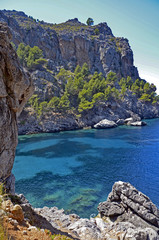 Fototapeta premium A rocky bay with turquoise water on Balearic island of Majorca, Spain