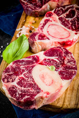 Fresh raw beef meat with spices for cooking, top view copy space