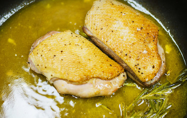 Process of making turkey breast in a frying pan with orange sauce. 