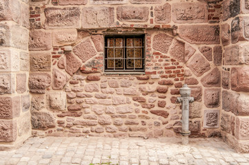 Fototapeta na wymiar Old stone wall with little window, Nuremberg