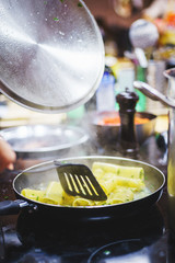 Classic penne with mussels and tomatoes in a frying pan. 