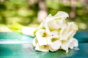 love, dating or wedding day concept - bouquet white callas flowers