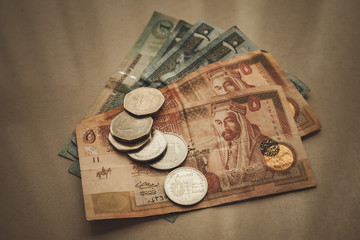 Jordanian dinars and piastres, retro stylized