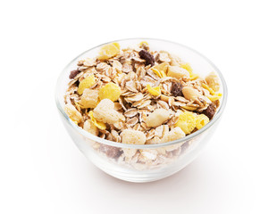 Glass bowl full of cereal muesli isolated on white