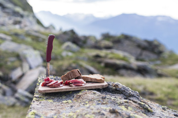 bacon on wood plate on a mountain in south tyrol