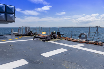 soldiers firing from the deck of a warship in the Black Sea/Bulgaria/07.19.2018 during the exercise.Editorial used only. sailors execute command, shooting on a moving target. © Ivan