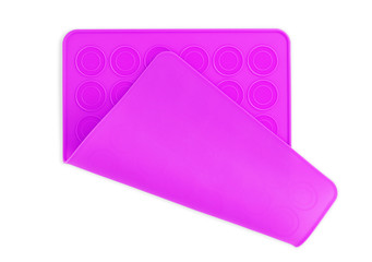 A color silicone muffin molds on a white background