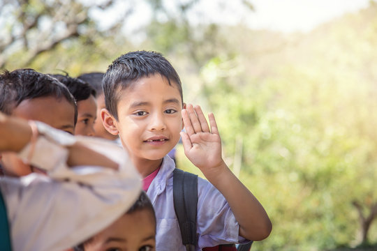 Portrait of Indian rural school Boy standing in queue during morning assembly outdoor