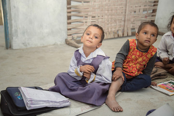 Portrait of Indian rural pre school girls in classroom at village school.