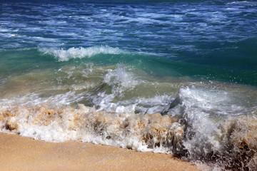 Wave crashes on to the shore. Caribian sea