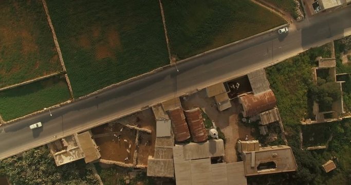 Aerial Shot - Camera moving downwards over a quiet street
