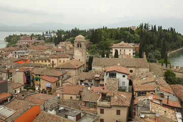 Fototapeta na wymiar The view of Sirmione city from Medieval fortress walls, Italy