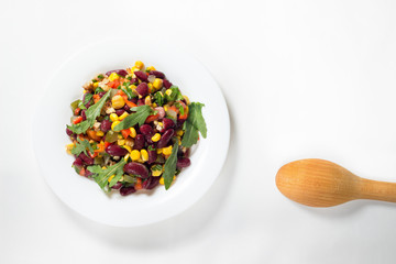 Bean and corn salad with pepper on white background