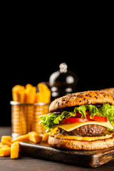 Delicious grilled burgers © George Dolgikh