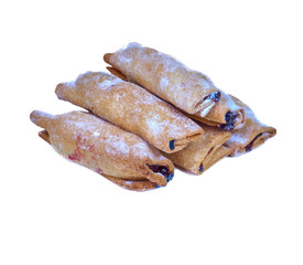 Cookies rolled with cherries and black currants isolated on a white background. Sweet dessert