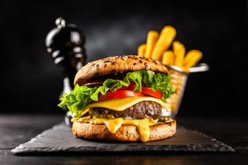 Delicious grilled burgers - obrazy, fototapety, plakaty
