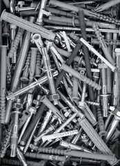 Lot of fasteners and fixings background: anchors, plugs, screws, nails, bolts, nuts, washers © Андрей Водилин