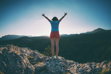 Girl at the top of the mountain.