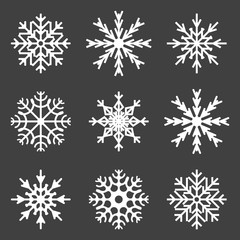 Fototapeta na wymiar Set of snowflake icons. Vector on a gray background.