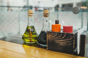 souses close up in bottles. cafe concept