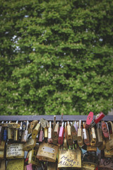 Paris, France - Apr 13 2017: Love padlocks at bridge over Seine river.