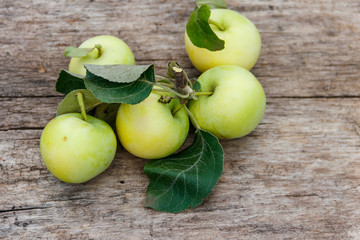 Fresh ripe apples on rustic wooden table