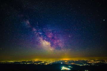 Milky Way above the city lights with pollution