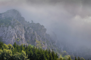 Mount Resegone nestled in the clouds. Lecco province, Lombardy, Italy.