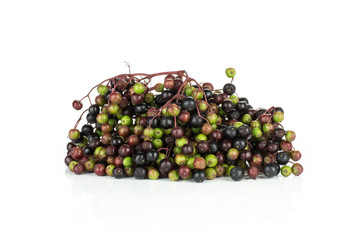 Lot of whole fresh european black elderberry heap isolated on white background