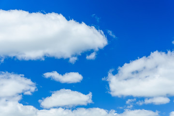 White fluffy clouds in deep blue sky