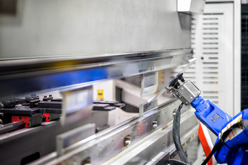 Hand robot working automatic cutting and bending metal sheet by high precision metal sheet bending...