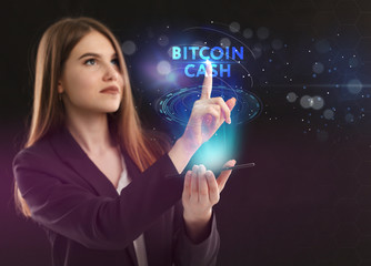 The concept of business, technology, the Internet and the network. A young entrepreneur working on a virtual screen of the future and sees the inscription: bitcoin cash