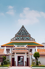 Naklejka premium Chinese inspired Main hall architecture and gate of Wat Ratchaorotsaram temple Bangkok