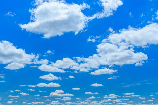 White fluffy clouds in deep blue sky © ihorbondarenko