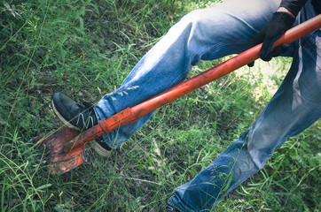 Man is digging a treasure chest with his shovel. Treasure hinting concept. In searching of ancient...