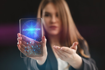 The concept of business, technology, the Internet and the network. A young entrepreneur working on a virtual screen of the future and sees the inscription: Automation