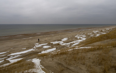 Winter beach on the Curonian Spit in cloudy weather